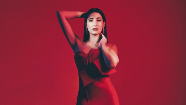 Nora Fatehi Red background Wallpaper